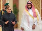 A handout picture provided by the Saudi Royal Palace shows Saudi Arabia's Crown Prince Mohammed Bin Salman (R) welcoming Pakistani Prime Minister Shehbaz Sharif in Jeddah.(AFP)