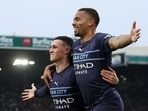 Manchester City's Gabriel Jesus celebrates scoring their third goal with Phil Foden