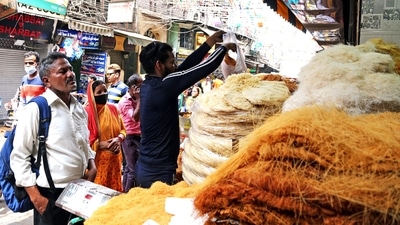 People purchase vermicelli outside Jama Masjid ahead of the Eid al-Fitr festival, in New Delhi on Sunday. (ANI Photo) People purchase vermicelli outside Jama Masjid ahead of the Eid al-Fitr festival, in New Delhi on Sunday. (ANI Photo)