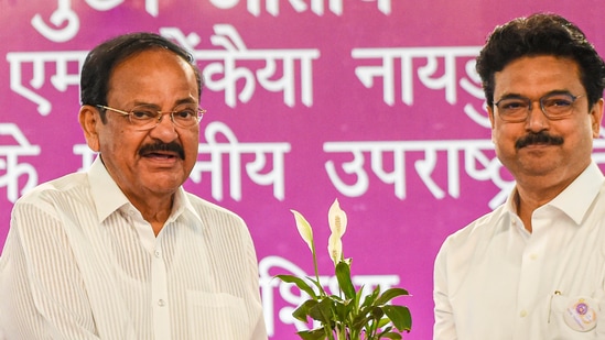 Vice President M. Venkaiah Naidu being presented a memento by Delhi University Vice-Chancellor Yogesh Singh during Delhi University's centenary celebrations, at the university's North Campus, in New Delhi, Sunday, May 1, 2022. (PTI Photo/Manvender Vashist)