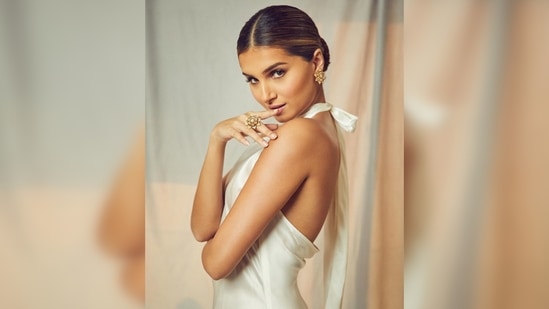 Tara Sutaria's hair was parted in the middle and pulled back for a sleek low bun.(Instagram/@tarasutaria)