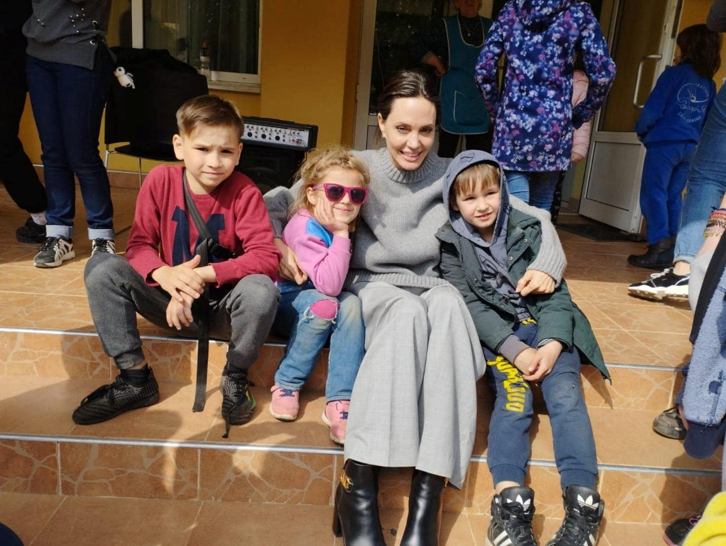 Actor and UNHCR Special Envoy Angelina Jolie poses for a picture with children, as Russia's attack on Ukraine continues, in Lviv, on April 30, 2022.&nbsp; (via Reuters)