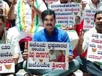 Bengaluru, April 29 (ANI): Congress supporters stage a protest at Congress Bhavan, demanding the resignation of Home Minister Araga Jnanendra after a prime accused in PSI scam arrested by CID police in Pune, on Friday. (ANI Photo) Bengaluru, April 29 (ANI): Congress supporters stage a protest at Congress Bhavan, demanding the resignation of Home Minister Araga Jnanendra after a prime accused in PSI scam arrested by CID police in Pune, on Friday. (ANI Photo)