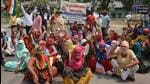 Door-to-door garbage collectors staging a sit-in against the Panchkula MC’s office. (Sant Arora /HT) Door-to-door garbage collectors staging a sit-in against the Panchkula MC’s office. (Sant Arora /HT)