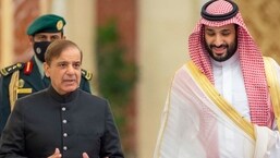 A handout picture provided by the Saudi Royal Palace shows Saudi Arabia's Crown Prince Mohammed Bin Salman (R) welcoming Pakistani Prime Minister Shehbaz Sharif in Jeddah. (AFP)
