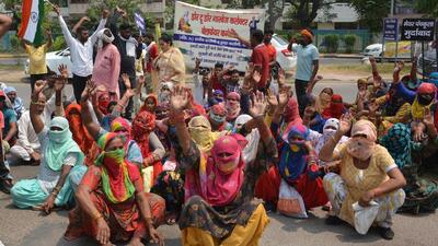 Door-to-door garbage collectors staging a sit-in against the Panchkula MC’s office. (Sant Arora /HT) Door-to-door garbage collectors staging a sit-in against the Panchkula MC’s office. (Sant Arora /HT)