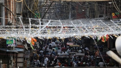 People gather at a market ahead of the Eid al-Fitr festival, which marks the end of the Muslim fasting month of Ramadan, in the old quarter of Delhi on Sunday. (REUTERS)