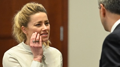 Amber Heard looks on during a trial in the Fairfax County Circuit Courthouse in Fairfax, Virginia (Photo by JIM WATSON / POOL / AFP) (AFP)