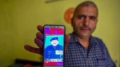 Bal Mukund Choubey shows an old photograph from when he was in the army. (Amal KS/HT) Bal Mukund Choubey shows an old photograph from when he was in the army. (Amal KS/HT)