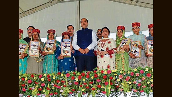 Himachal CM Jai Ram Thakur (centre) during the social security pension disbursal event at Shahpur in Kangra on Monday (HT Photo)