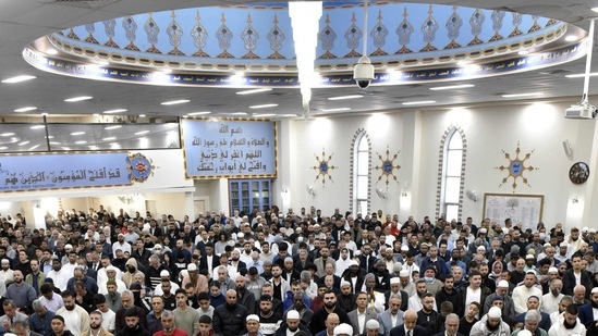 Muslims offer an Eid al-Fitr prayer at the Lekamba mosque in western Sydney on Monday to mark the end of the holy fasting month of Ramadan. Since the United States, United Kingdom, Canada and European countries rely on the moon announcement by the Saudi Arabia Royal Court, Muslims there will also mark Eid celebrations with the Gulf states.(AFP)