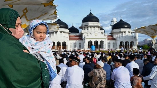 People gather for Eid al-Fitr prayers which marks the end of the holy month of Ramadan at Baiturrahman grand mosque in Banda Aceh, Indonesia on Monday.(AFP)