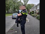 The image shows the boy with a cop whom police dubbed as ‘new Max Verstappen’ after he took his mom's car on a joyride,(Instagram/@politie_utrechtnoord)