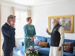 Prime Minister Narendra Modi interacts with Prime Minister of Denmark Mette Frederiksen as she shows him the painting he gifted her during her last visit to India, at her residence in Copenhagen.(PTI) Prime Minister Narendra Modi interacts with Prime Minister of Denmark Mette Frederiksen as she shows him the painting he gifted her during her last visit to India, at her residence in Copenhagen.(PTI)