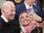 US President Joe Biden poses for a selfie while hosting a reception to celebrate Eid al-Fitr at the White House in Washington, U.S.