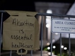 A sign hangs on a fence outside the US Supreme Court as protesters react to the leak of a draft majority opinion written by Justice Samuel Alito preparing for a majority of the court to overturn the landmark Roe v. Wade abortion rights decision.