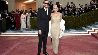 Kim Kardashian dons one of Marilyn Monroe's most iconic dresses, a gold-beaded body-fitted ensemble that Monroe wore when she sang happy birthday to President John F. Kennedy 60 years ago. Kim had to lose 16 pounds to fit into the dress. (Evan Agostini/Invision/AP) Kim Kardashian dons one of Marilyn Monroe's most iconic dresses, a gold-beaded body-fitted ensemble that Monroe wore when she sang happy birthday to President John F. Kennedy 60 years ago. Kim had to lose 16 pounds to fit into the dress. (Evan Agostini/Invision/AP)