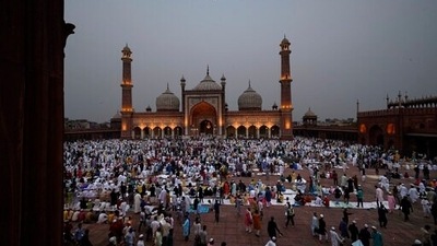 People gather to offer Eid al-Fitr prayers at the Jama Masjid in New Delhi on May 3, 2022. The Eid al-Fitr festival marks the end of the fasting month of Ramadan and lasts for three days. (AP Photo/Manish Swarup) People gather to offer Eid al-Fitr prayers at the Jama Masjid in New Delhi on May 3, 2022. The Eid al-Fitr festival marks the end of the fasting month of Ramadan and lasts for three days. (AP Photo/Manish Swarup)