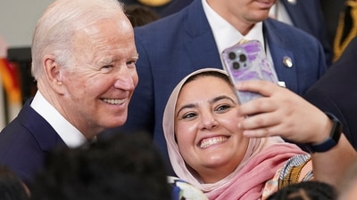 US President Joe Biden poses for a selfie while hosting a reception to celebrate Eid al-Fitr at the White House in Washington, U.S. (REUTERS)