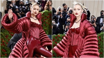 Gigi Hadid in Versace red corset jumpsuit and giant cape jacket makes heads turn at Met Gala 2022 (Instagram/@metgalaofficial) Gigi Hadid in Versace red corset jumpsuit and giant cape jacket makes heads turn at Met Gala 2022 (Instagram/@metgalaofficial)