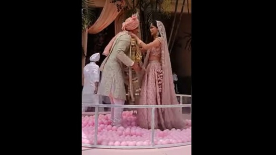 The bride and groom exchange garlands in a ball pool in this Instagram video.&nbsp; (Instagram/@wedmegood)