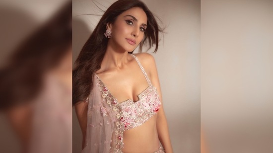 Vaani Kapoor casts a spell on her fans with her grace and charm as she walks the ramp in this dreamy lehenga.(Instagram/@_vaanikapoor_)