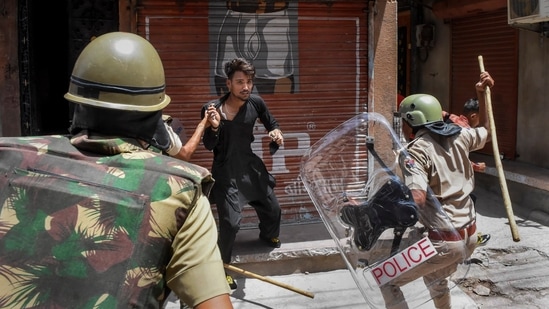 Police charge a miscreant to maintain peace after clashes broke out between two communities on Eid-ul-Fitr, in Jalori Gate area, in Jodhpur, Tuesday, May 3, 2022. (PTI Photo)