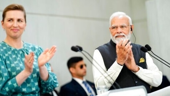 Indian Prime Minister Narendra Modi and his Danish counterpart Mette Frederiksen, left, applaud during their joint press conference at the prime minister's official residence Marienborg, in Kongens Lyngby, north of Copenhagen, Denmark, Tuesday, May 3, 2022. (Martin Sylvest/Ritzau Scanpix via AP)