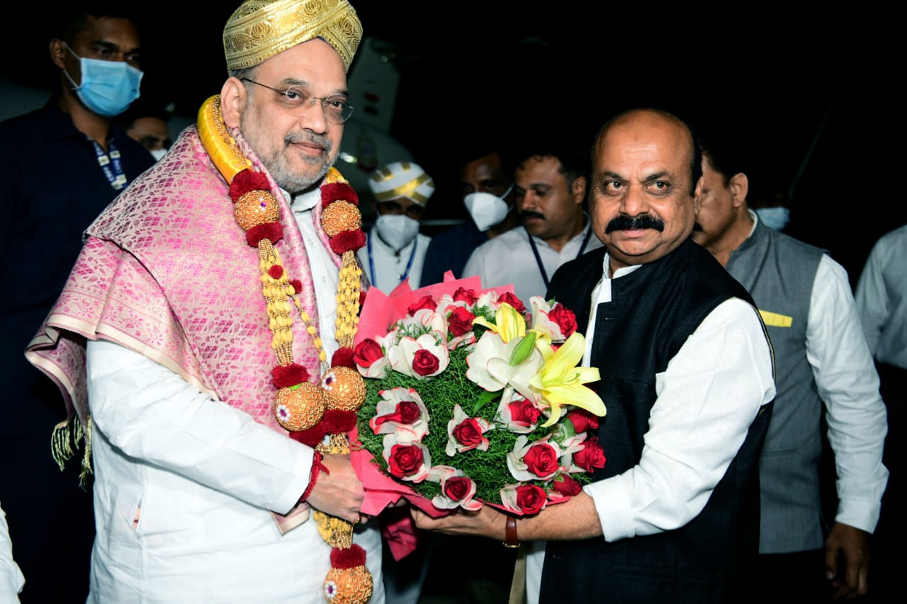 Union Home Minister Amit Shah being received by Karnataka Chief Minister Basavaraj Bommai at HAL airport, in Bengaluru on Tuesday. (ANI Photo)