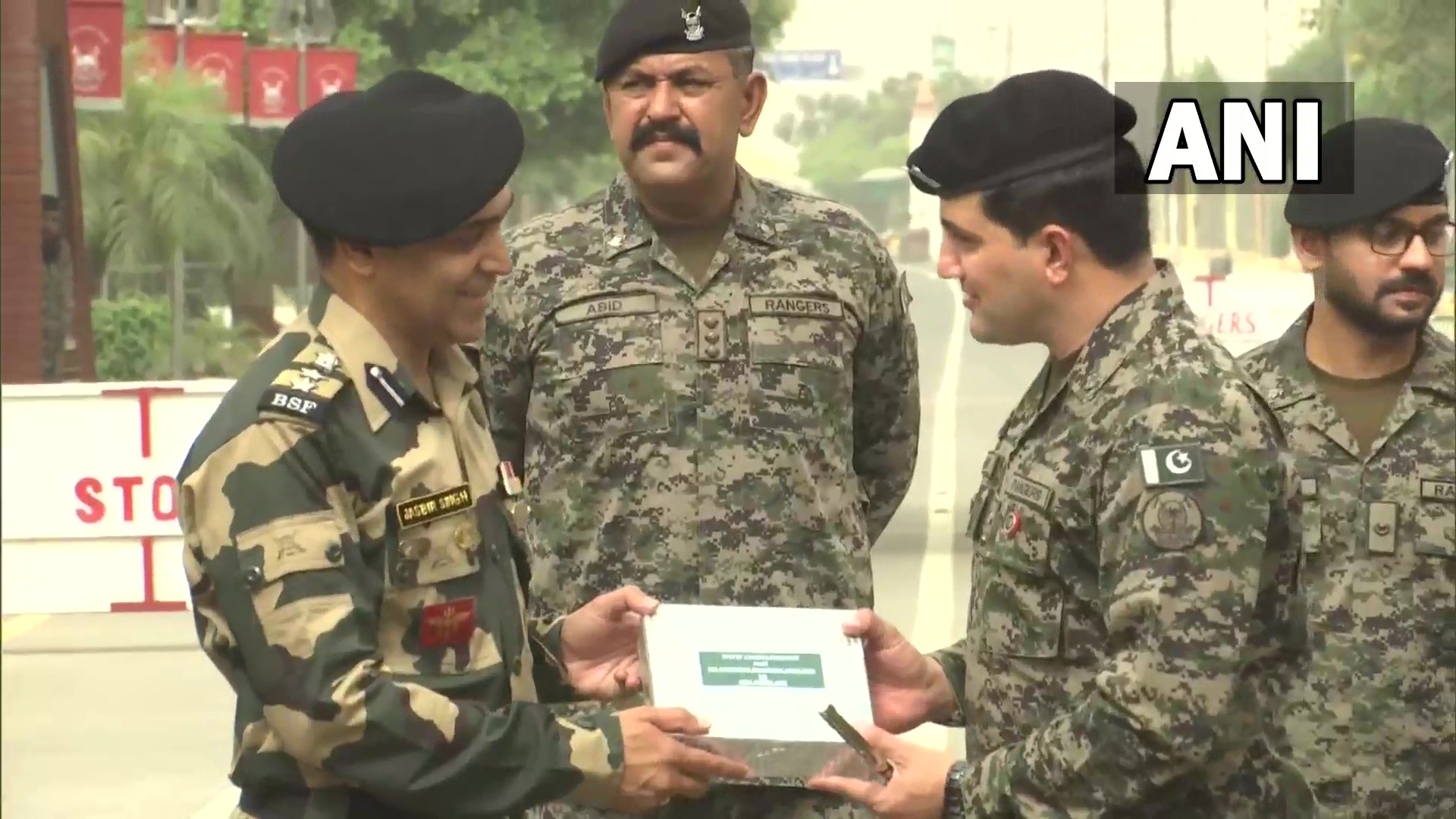 BSF officials, Pakistan Rangers officials exchange sweets in Punjab on Eid. BSF officials, Pakistan Rangers officials exchange sweets in Punjab on Eid.