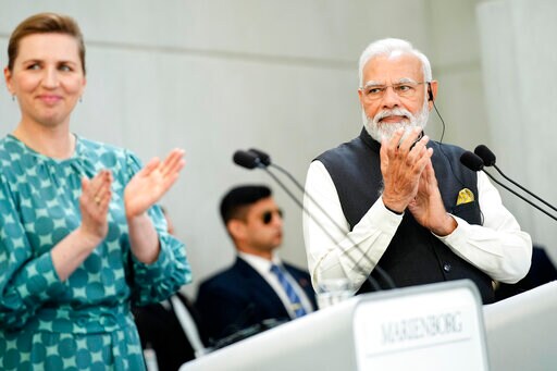 Indian Prime Minister Narendra Modi and his Danish counterpart Mette Frederiksen, left, applaud during their joint press conference at the prime minister's official residence Marienborg, in Kongens Lyngby, north of Copenhagen, Denmark, Tuesday, May 3, 2022. (Martin Sylvest/Ritzau Scanpix via AP) Indian Prime Minister Narendra Modi and his Danish counterpart Mette Frederiksen, left, applaud during their joint press conference at the prime minister's official residence Marienborg, in Kongens Lyngby, north of Copenhagen, Denmark, Tuesday, May 3, 2022. (Martin Sylvest/Ritzau Scanpix via AP)