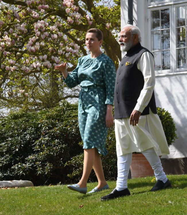 Denmark's Prime Minister Mette Frederiksen interacts with her Indian counterpart Narendra Modi in Copenhagen on Tuesday, May 3, 2022. (PMO India)
