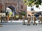 Police personnel deployed during a curfew imposed following the clash between two groups in Jodhpur, on Wednesday. (ANI)