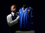 The shirt worn by Diego Maradona in the 1986 Mexico World Cup quarterfinal soccer match between Argentina and England, is displayed for photographs at Sotheby's auction house, in London(AP/File)