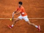 Serbia's Novak Djokovic returns the ball against Gael Monfils, of France, during their match at the Mutua Madrid Open tennis tournament in Madrid, Spain, Tuesday, May 3, 2022.(AP)