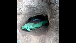 A small opening found in the general area near fencing in Jammu’s Samba area suspected to be a tunnel. (HT Photo)