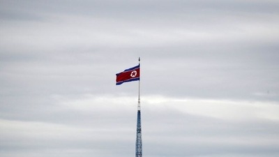 FILE PHOTO: A North Korean flag flutters on top of a 160-metre tower in North Korea's propaganda village of Gijungdong, (REUTERS)