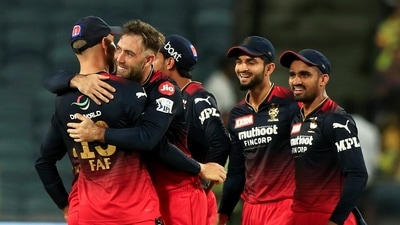 Pune: Glenn Maxwell of Royal Challengers Bangalore celebrates with teammates, the wicket of Robin Uthappa of Chennai Super Kings during the 49th T20 cricket match of the Indian Premier League 2022 (IPL season 15), between the Royal Challengers Bangalore and the Chennai Super Kings, at MCA International Stadium in Pune, Wednesday, May 4, 2022. (Sportzpics for IPL/PTI Photo)(PTI05_04_2022_000231B) (PTI) Pune: Glenn Maxwell of Royal Challengers Bangalore celebrates with teammates, the wicket of Robin Uthappa of Chennai Super Kings during the 49th T20 cricket match of the Indian Premier League 2022 (IPL season 15), between the Royal Challengers Bangalore and the Chennai Super Kings, at MCA International Stadium in Pune, Wednesday, May 4, 2022. (Sportzpics for IPL/PTI Photo)(PTI05_04_2022_000231B) (PTI)