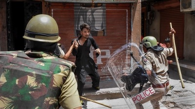 Police charge a miscreant to maintain peace after clashes broke out between two communities on Eid-ul-Fitr, in Jalori Gate area, in Jodhpur (PTI Photo) Police charge a miscreant to maintain peace after clashes broke out between two communities on Eid-ul-Fitr, in Jalori Gate area, in Jodhpur (PTI Photo)