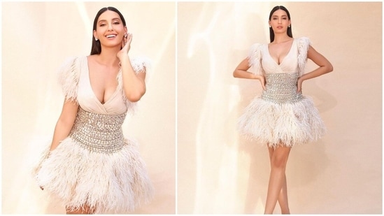 Nora Fatehi loves all things fashion. The actor can pull off any outfit and her public appearances and social media handles are proof. Along with praises and compliments, celebs also have to deal with a lot of hate comments. The Moroccan beauty slammed the haters through gorgeous pictures of herself in a short white fur dress.(Instagram/@norafatehi)