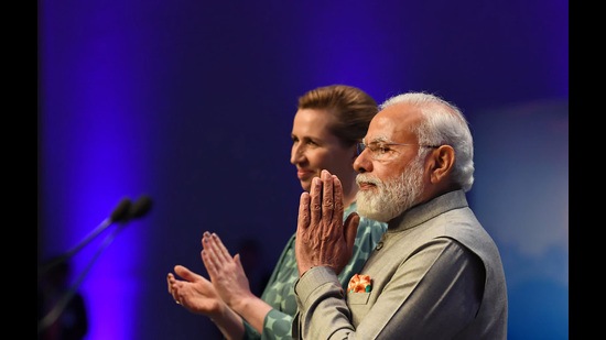 Prime Minister Narendra Modi greets the members of the Indian community in Copenhagen, Denmark. Prime Minister of Denmark Mette Frederiksen is also seen (PTI)