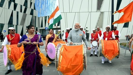 In a light moment, PM Modi was also seen trying his hand at playing an Indian 'dhol' (drum) in Copenhagen, while interacting with the Indian diaspora in the European country.(ANI)