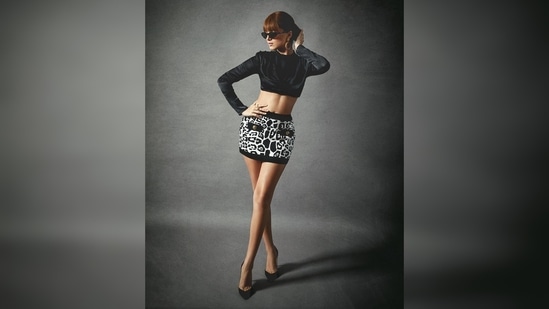 All eyes were on Tara Sutaria's toned abs as she struck professional poses for the camera with her hands placed near her head and legs crossed.(Instagram/@tarasutaria)