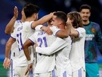 Real Madrid's Rodrygo celebrates after the match with Lucas Vazquez and teammates.