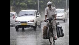 Harsh winters, scorching summers, torrential rains or menacing storms can rarely prevent him from delivering his wares at your doorstep. He is none other than your unpretentious and on the dot milkman. (HT file photo)