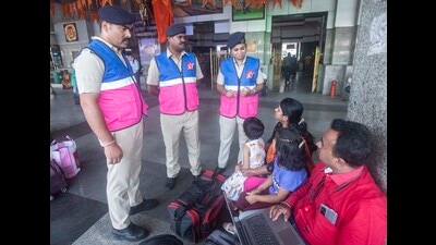 Railway Protection Force (RPF) personnel wearing children-friendly jackets interact with passengers at railway station. (Pratham Gokhale/HT Photo) Railway Protection Force (RPF) personnel wearing children-friendly jackets interact with passengers at railway station. (Pratham Gokhale/HT Photo)