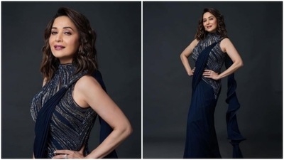 Madhuri Dixit was earlier seen giving a fusion touch to her traditional look in this embellished saree inspired dress. (Instagram/@gauravguptaofficial)