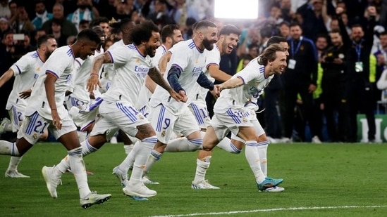 Champions League - Semi Final - Second Leg - Real Madrid v Manchester City - Real Madrid's Luka Modric, Karim Benzema and teammates celebrate after the match(REUTERS)