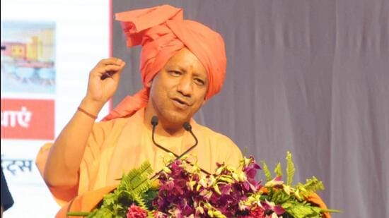 Uttar Pradesh chief minister Yogi Adityanath addressing a gathering after handing over the keys of Alaknanda hotel in Haridwar to chief minister Pushkar Singh Dhami (HT Photo/Rameshwar Gaur)