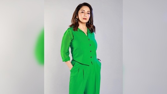 Madhuri Dixit completed her look with a watch, a bracelet, statement earrings and the most expensive jewellery a woman can wear, her smile.(Instagram/@madhuridixitnene)